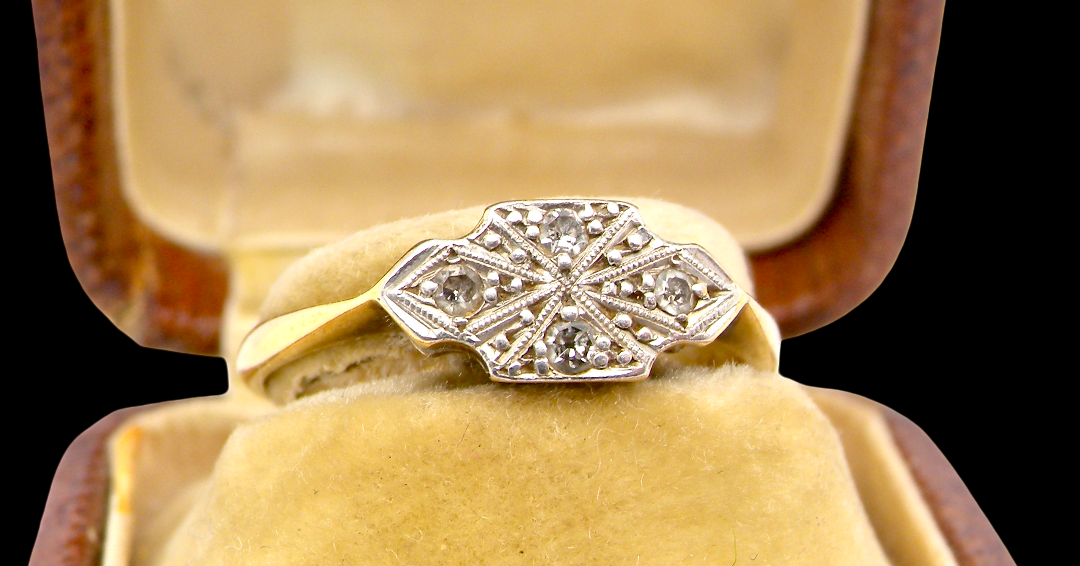 A pretty early 20th century Diamond ring, in its original box that makes this ring-extra special.