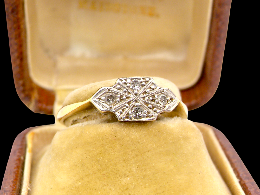 A pretty early 20th century Diamond ring, in its original box that makes this ring-extra special.