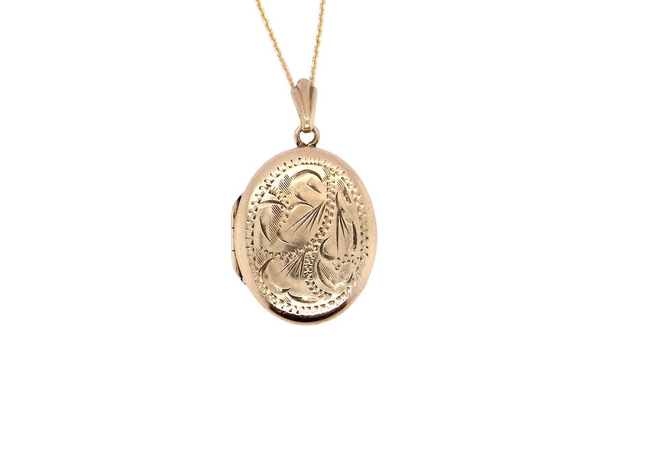 A pretty oval shaped locket. Measures 22x17mm. Hand engraved front, plain reverse
Hinges open, hallmarks for 1978.