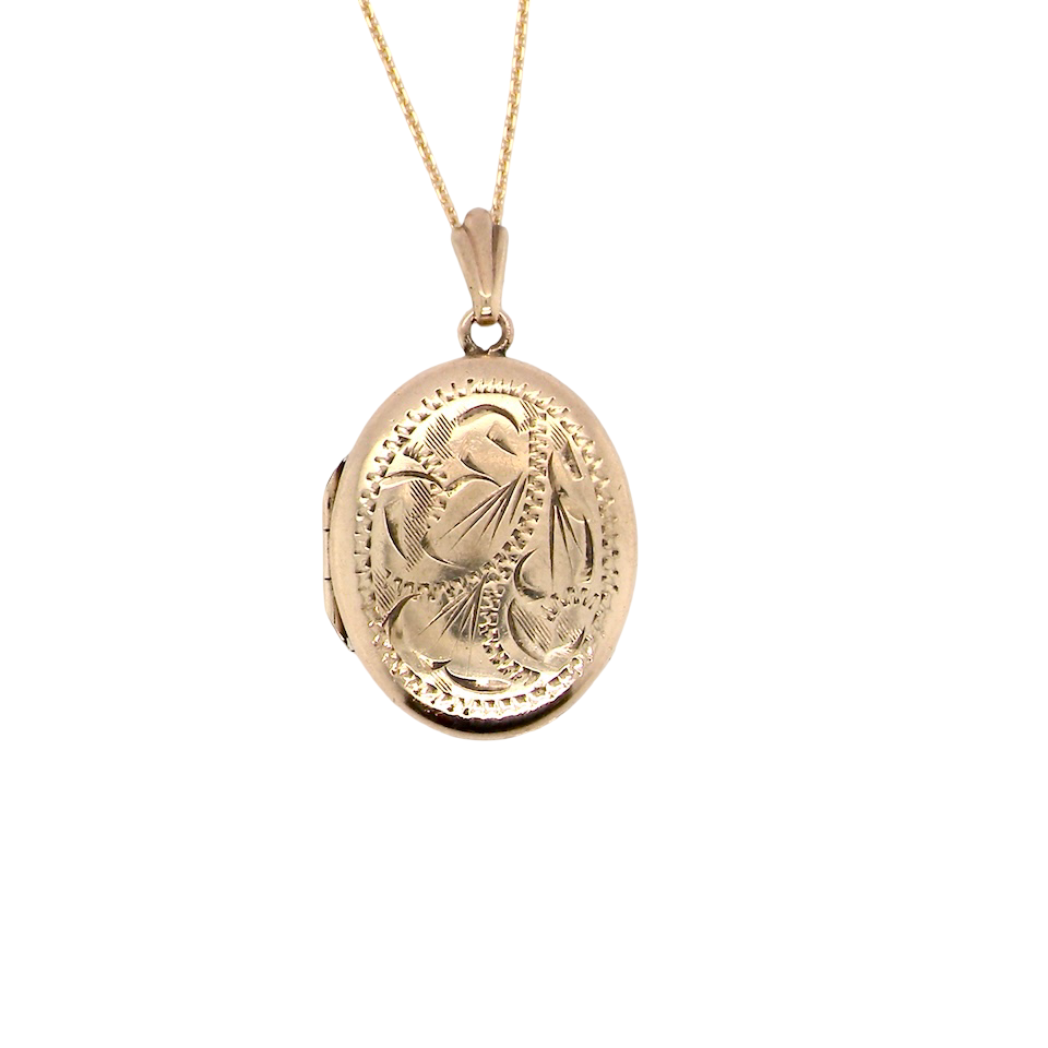 A pretty oval shaped locket. Measures 22x17mm. Hand engraved front, plain reverse
Hinges open, hallmarks for 1978.