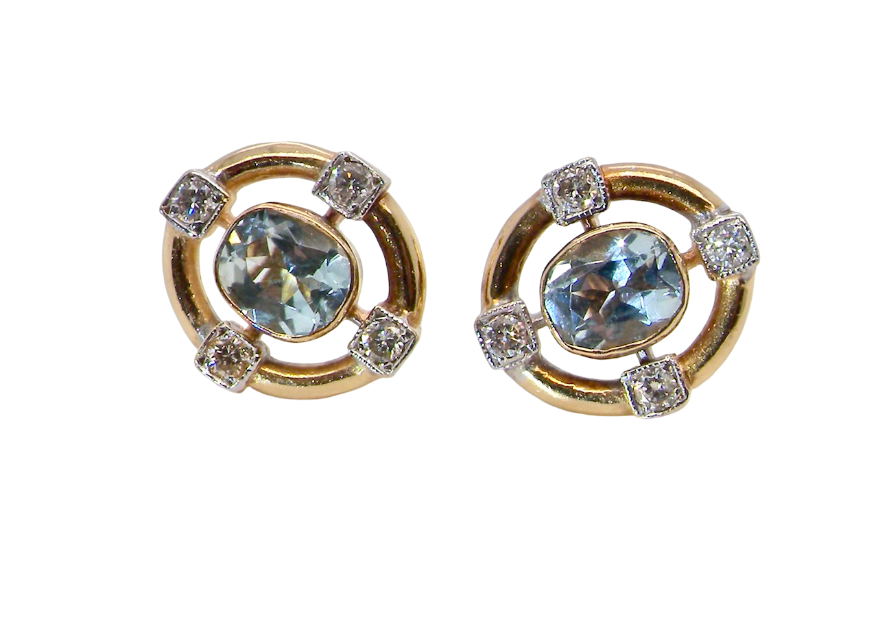 A pretty pair of earrings. Each is set with an aquamarine centre stone, 6x4.5mm,