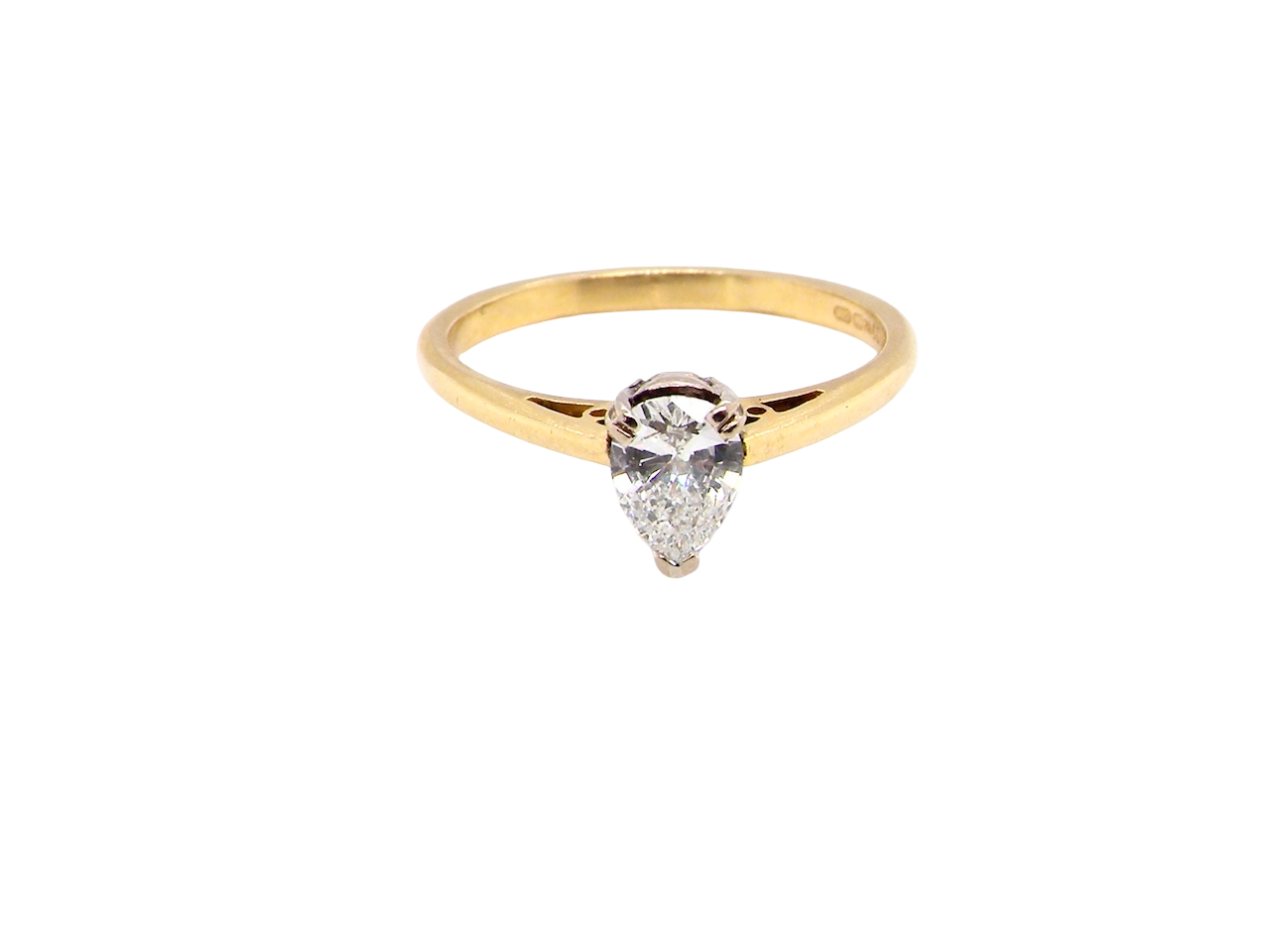 Gold ring with a teardrop-shaped diamond on a white background