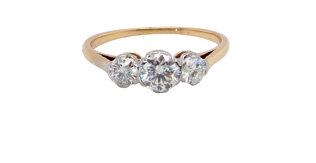A pretty three stone trilogy ring that features three brilliant cut white diamonds.
Centre diamond, 5mm (est 0.50 carats) each side a 4mm diamond (est 0.25 carats). Colour G-h, clarity Si. Platinum rim style setting, head measures 12.7x5.3mm, depth 5.3mm, weight 2.4grams.