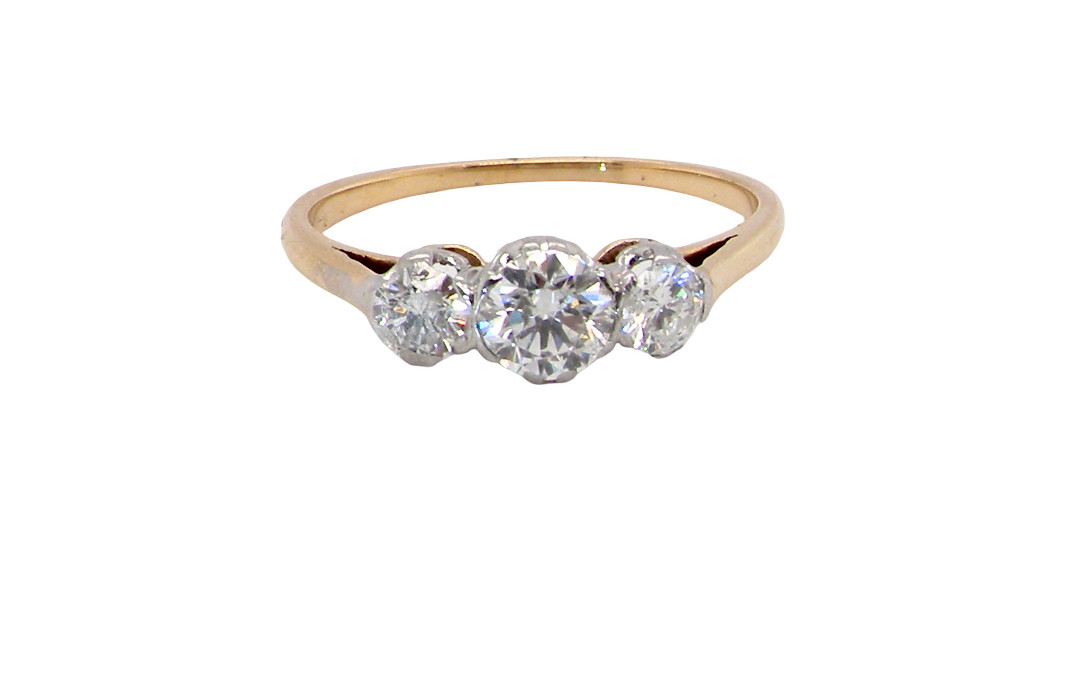 A pretty three stone trilogy ring that features three brilliant cut white diamonds.
Centre diamond, 5mm (est 0.50 carats) each side a 4mm diamond (est 0.25 carats). Colour G-h, clarity Si. Platinum rim style setting, head measures 12.7x5.3mm, depth 5.3mm, weight 2.4grams.