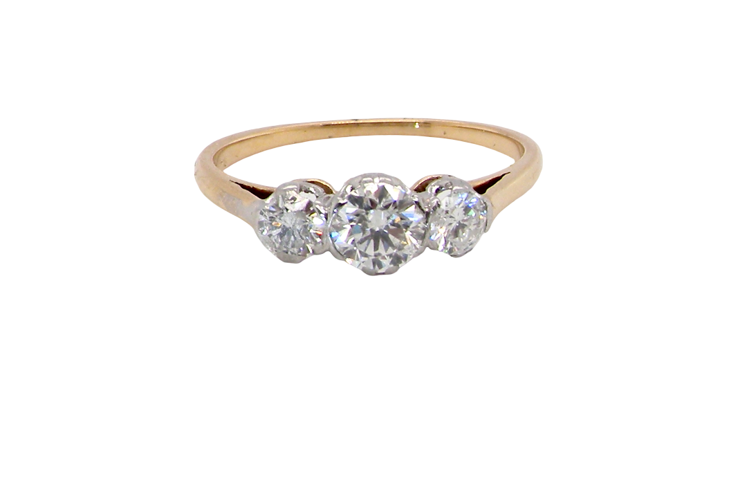 A pretty three stone trilogy ring that features three brilliant cut white diamonds.
Centre diamond, 5mm (est 0.50 carats) each side a 4mm diamond (est 0.25 carats). Colour G-h, clarity Si. Platinum rim style setting, head measures 12.7x5.3mm, depth 5.3mm, weight 2.4grams.