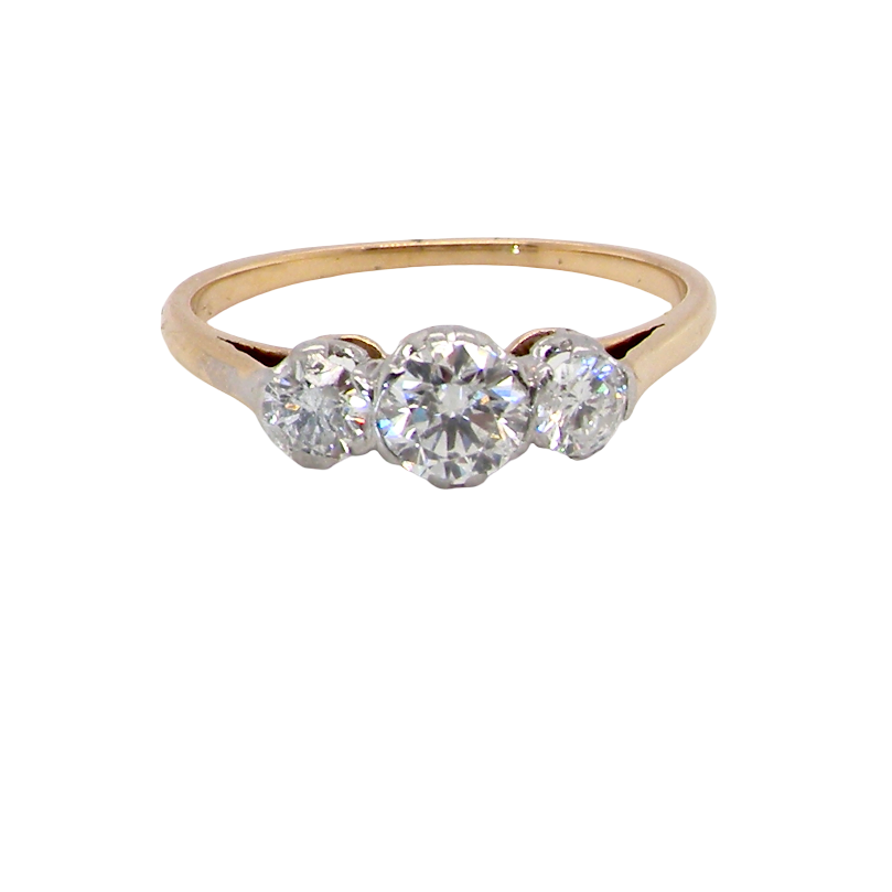 A pretty three stone trilogy ring that features three brilliant cut white diamonds.
Centre diamond, 5mm (est 0.50 carats) each side a 4mm diamond (est 0.25 carats). Colour G-h, clarity Si. Platinum rim style setting, head measures 12.7x5.3mm, depth 5.3mm, weight 2.4grams.