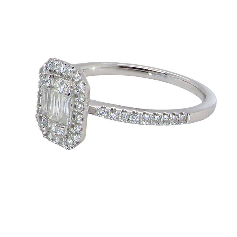 A rectangular diamond cluster ring. Centre portion is set with three baguette cut white diamonds 3x1.6mm and six mixed cut diamonds 2mm each. 
