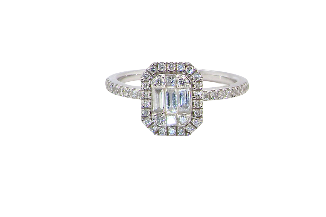A rectangular diamond cluster ring. Centre portion is set with three baguette cut white diamonds 3x1.6mm and six mixed cut diamonds 2mm each.
Surrounded by a halo of small round diamonds