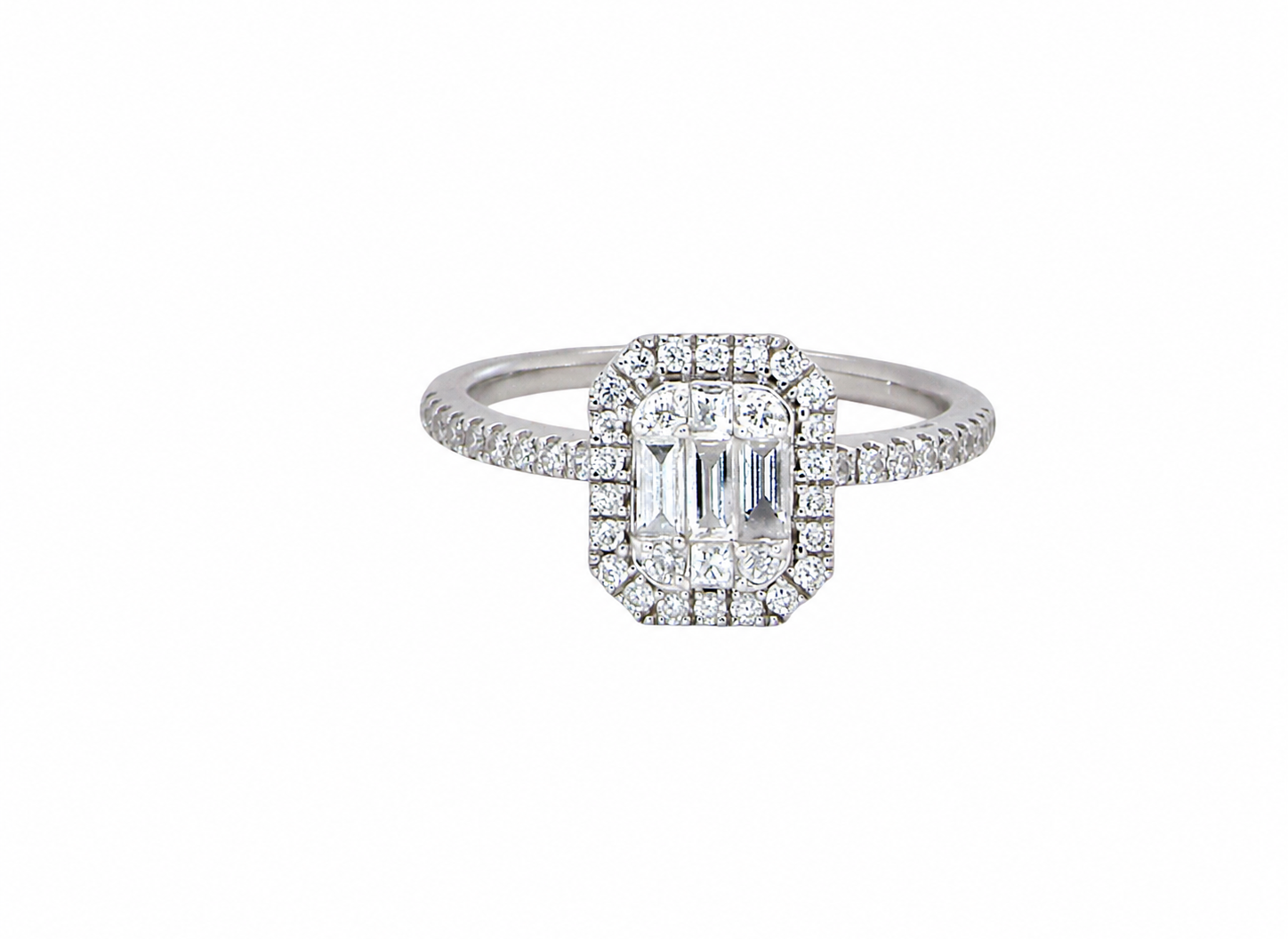 A rectangular diamond cluster ring. Centre portion is set with three baguette cut white diamonds 3x1.6mm