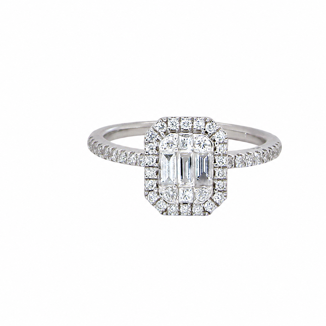 A rectangular diamond cluster ring. Centre portion is set with three baguette cut white diamonds 3x1.6mm