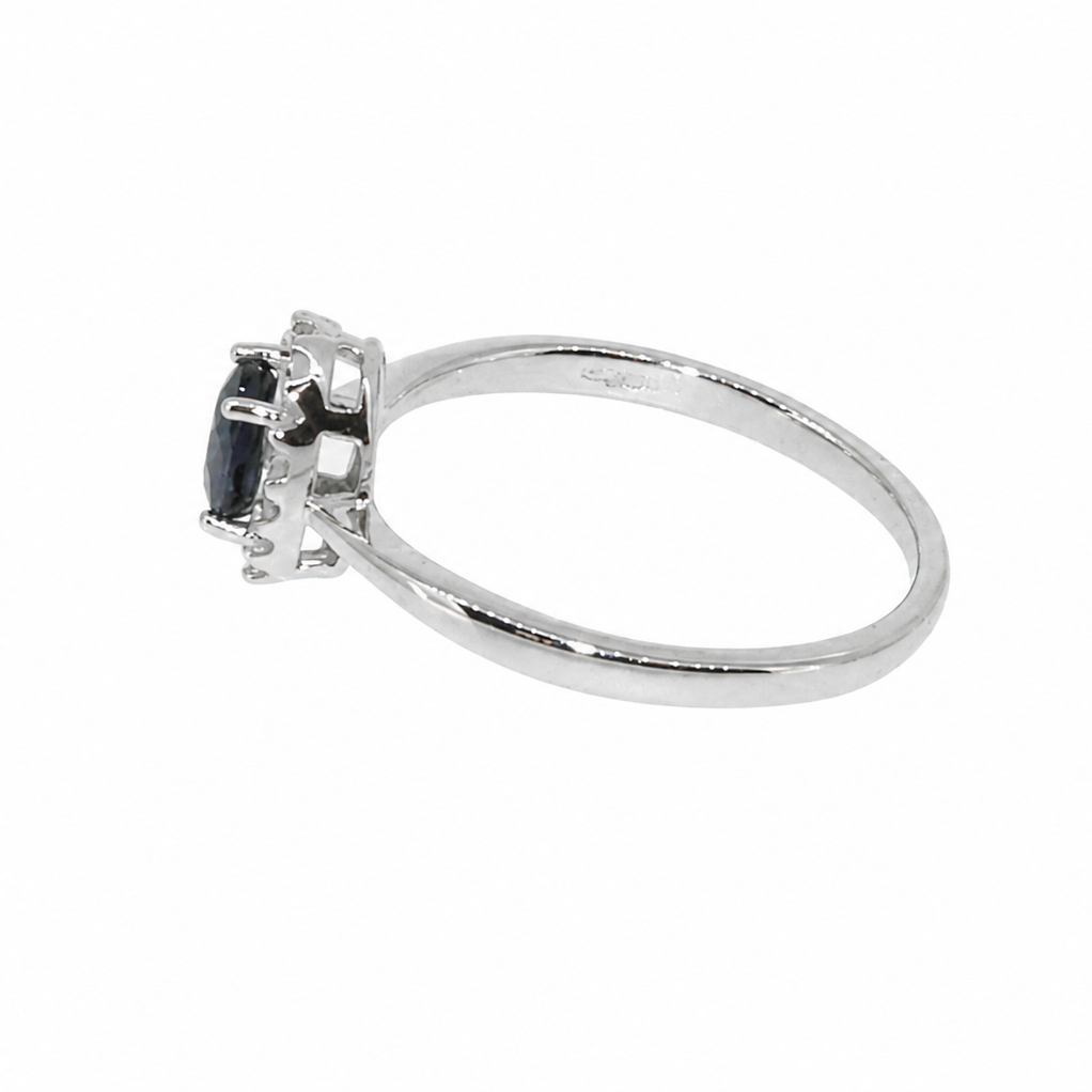 A sapphire & diamond cluster ring side view