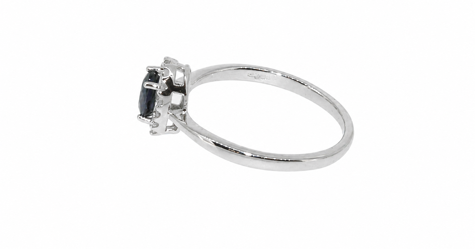A sapphire & diamond cluster ring side view