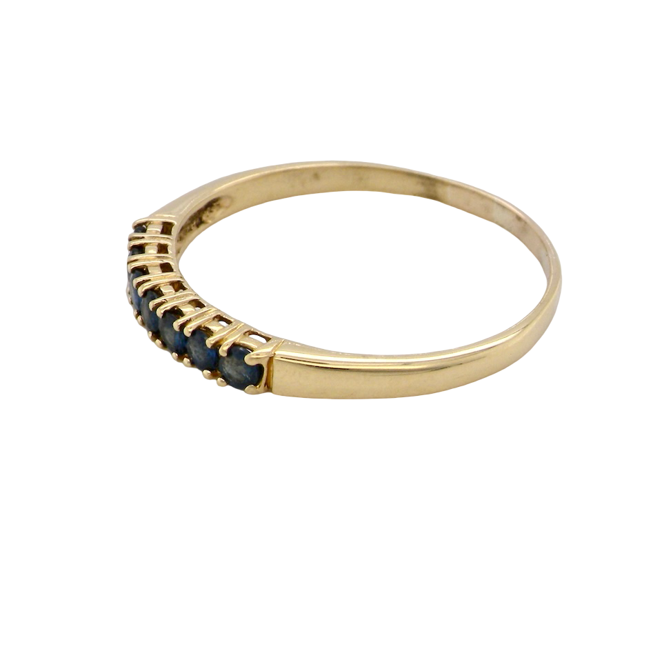 A sapphire half hoop eternity ring