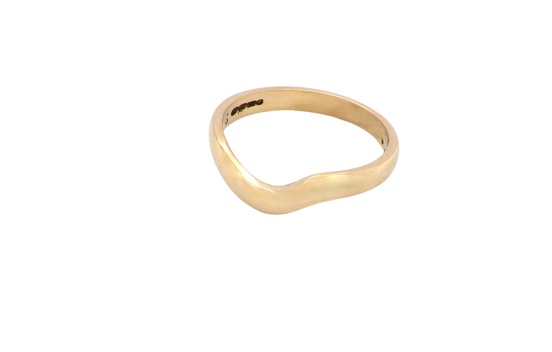 A shaped 18 carat yellow gold ring. Band width just under 3mm,