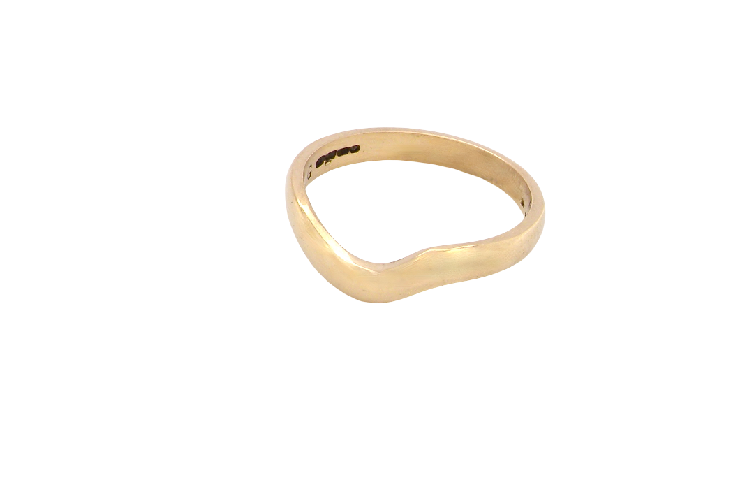 A shaped 18 carat yellow gold ring. Band width just under 3mm,
