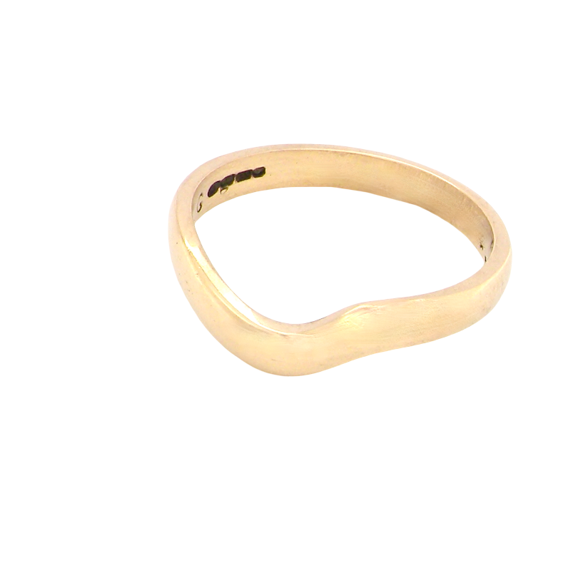 A shaped 18 carat yellow gold ring. Band width just under 3mm, weight 2.8grams.