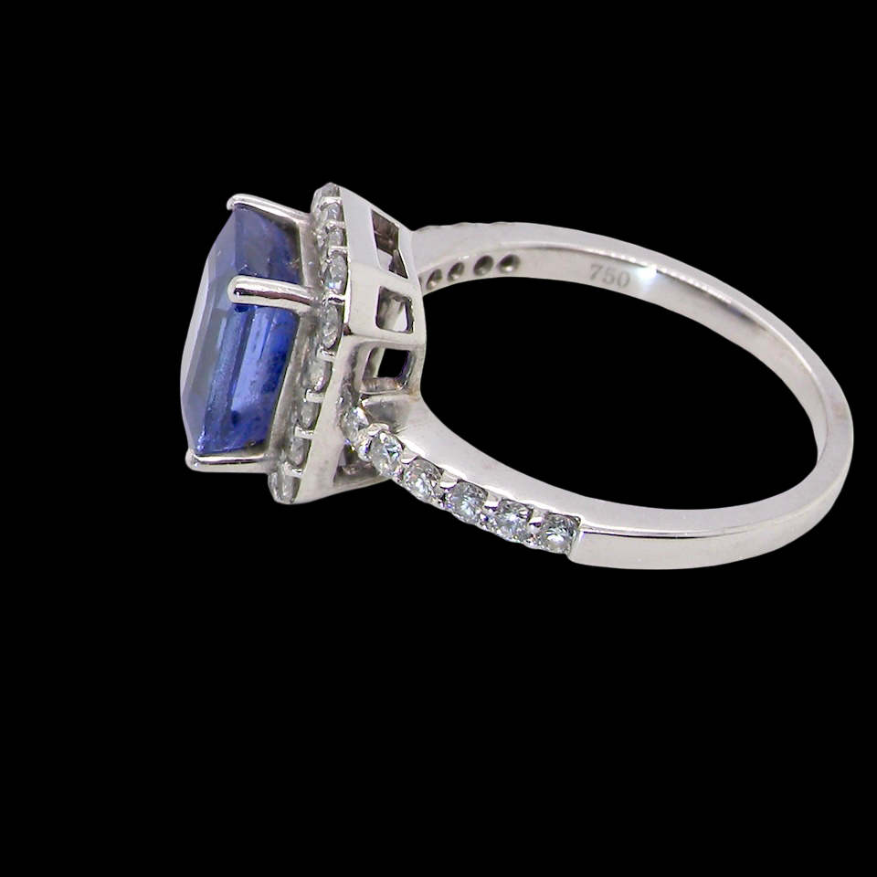 side cluster ring featuring a 4A quality Tanzanite as its centre stone. A