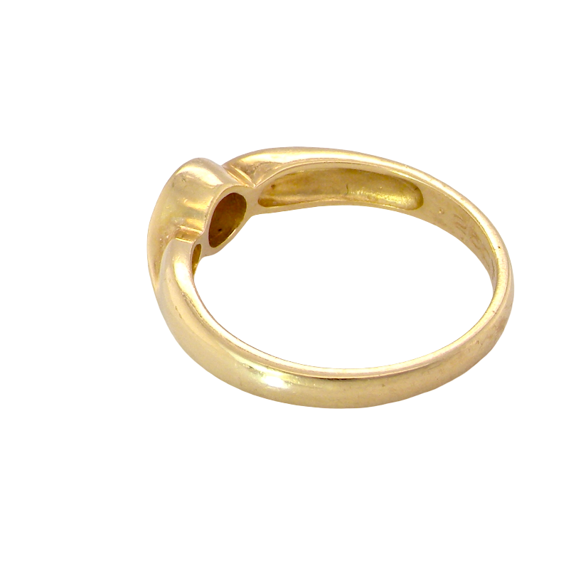 A polished yellow gold ring with a unique, organic curved shape and a circular cutout detail on the top, shown against a plain white background.