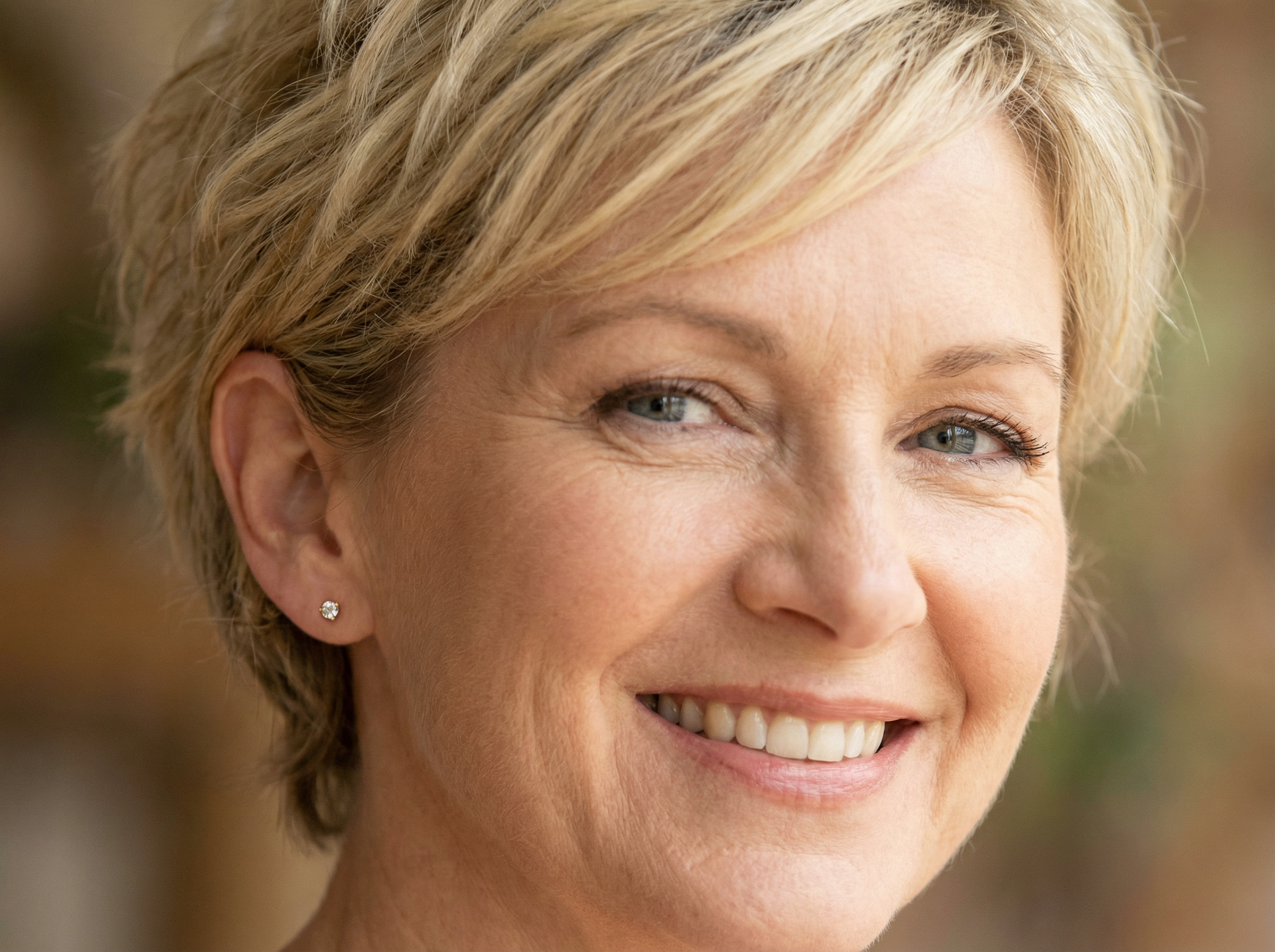 A simple pair of Diamond stud earrings modelled