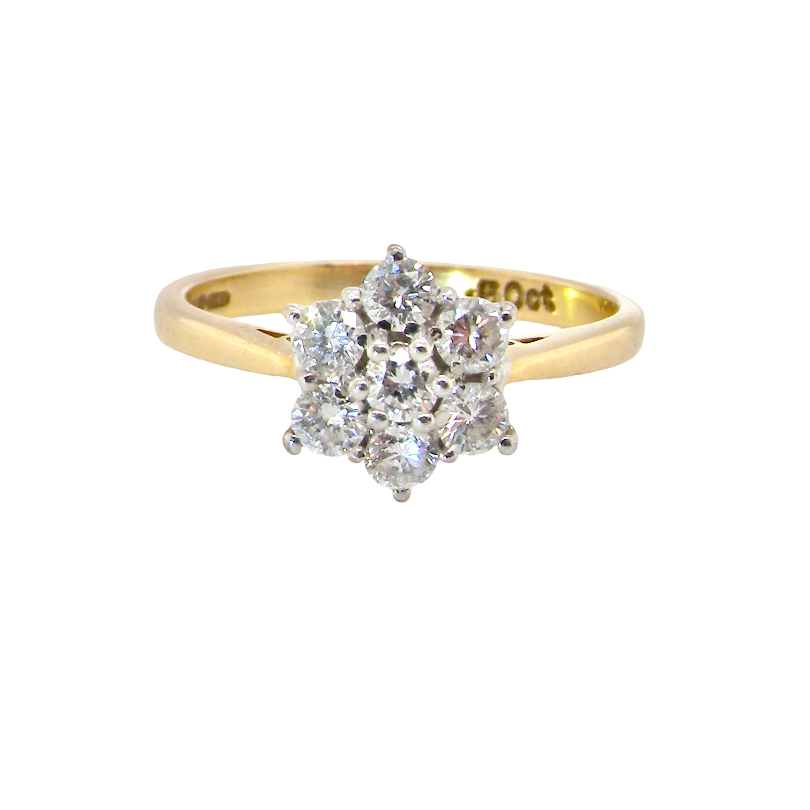 A small cluster ring set with seven bright white brilliant cut white diamonds.
Head measures 8.5mm, each diamond measures 2.8mm (total 0.50 carats