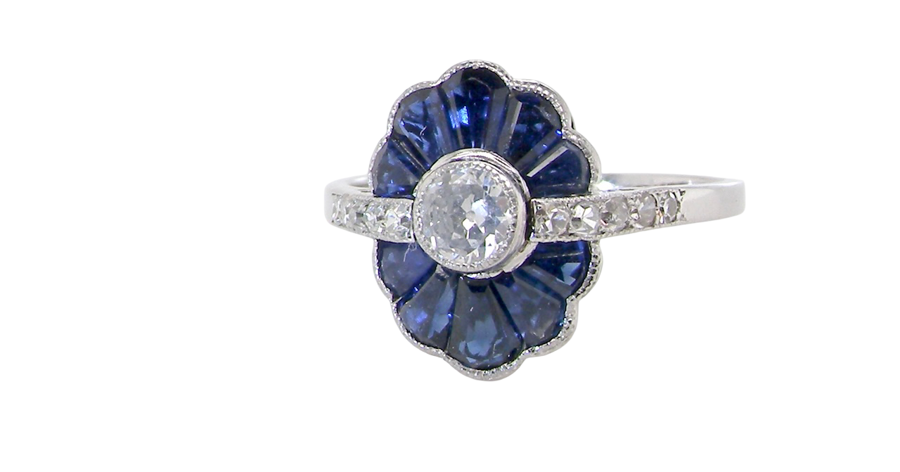 An Art Deco cluster ring a distinctive fan-shaped design.