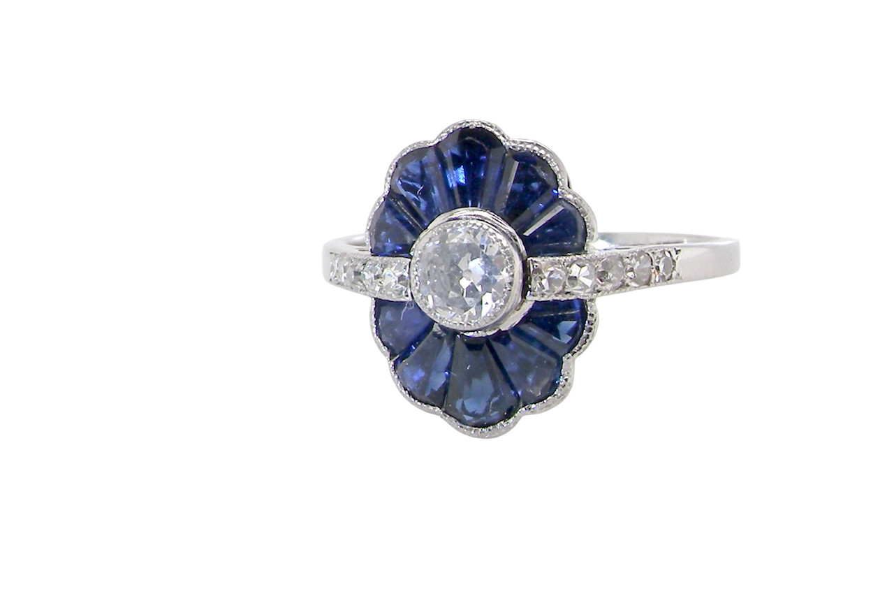 An Art Deco cluster ring a distinctive fan-shaped design.