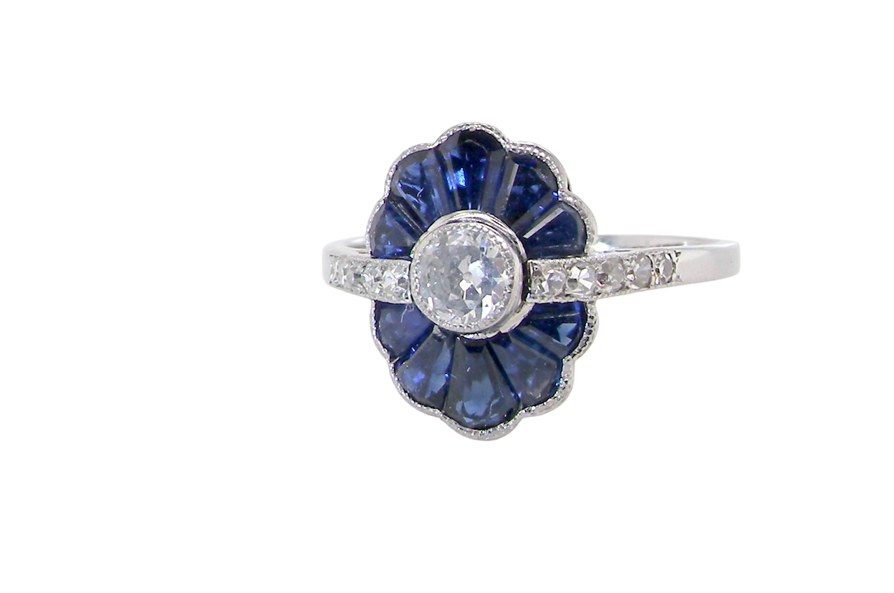 An Art Deco cluster ring a distinctive fan-shaped design.