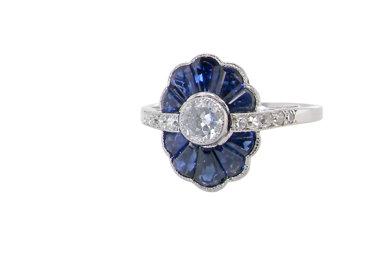 An Art Deco cluster ring a distinctive fan-shaped design.