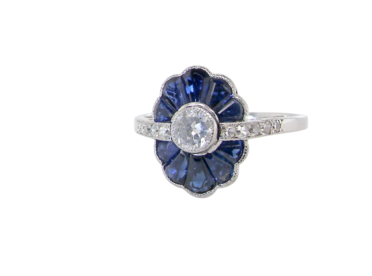 An Art Deco cluster ring a distinctive fan-shaped design.