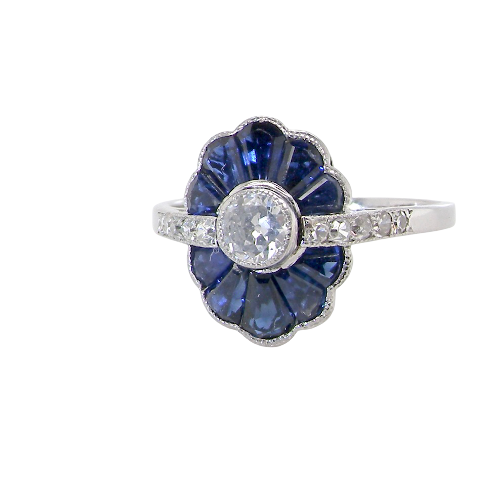 An Art Deco cluster ring a distinctive fan-shaped design.