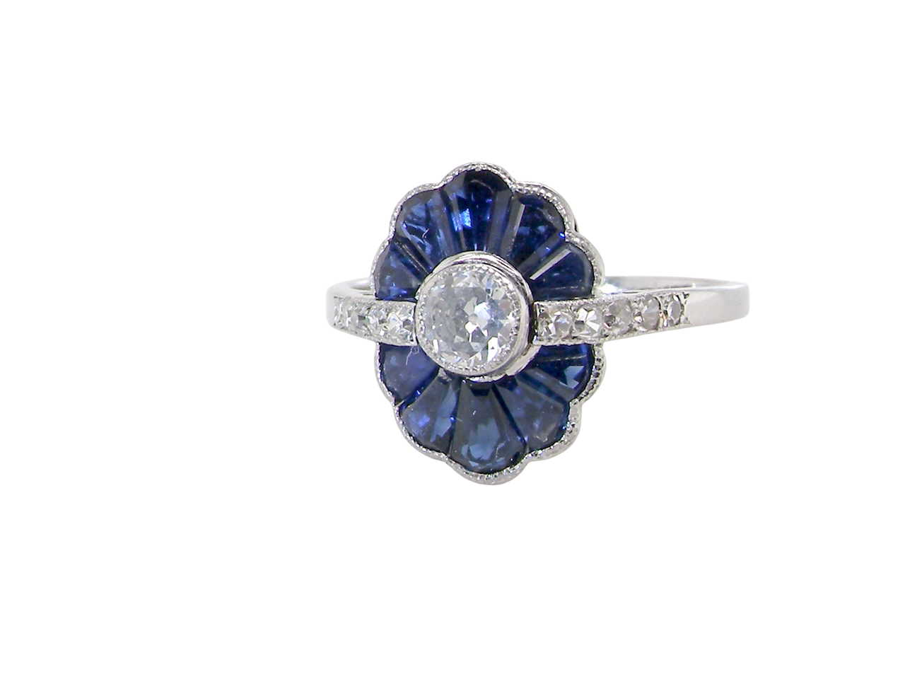 An Art Deco cluster ring a distinctive fan-shaped design.