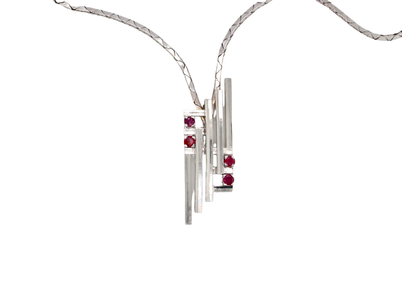 A striking modern pendant set with four 3mm rubies. The pendant measures approximately 40mm x 14mm and features a sleek design of five horizontal bars, with the outer bars each set with vibrant round rubies.