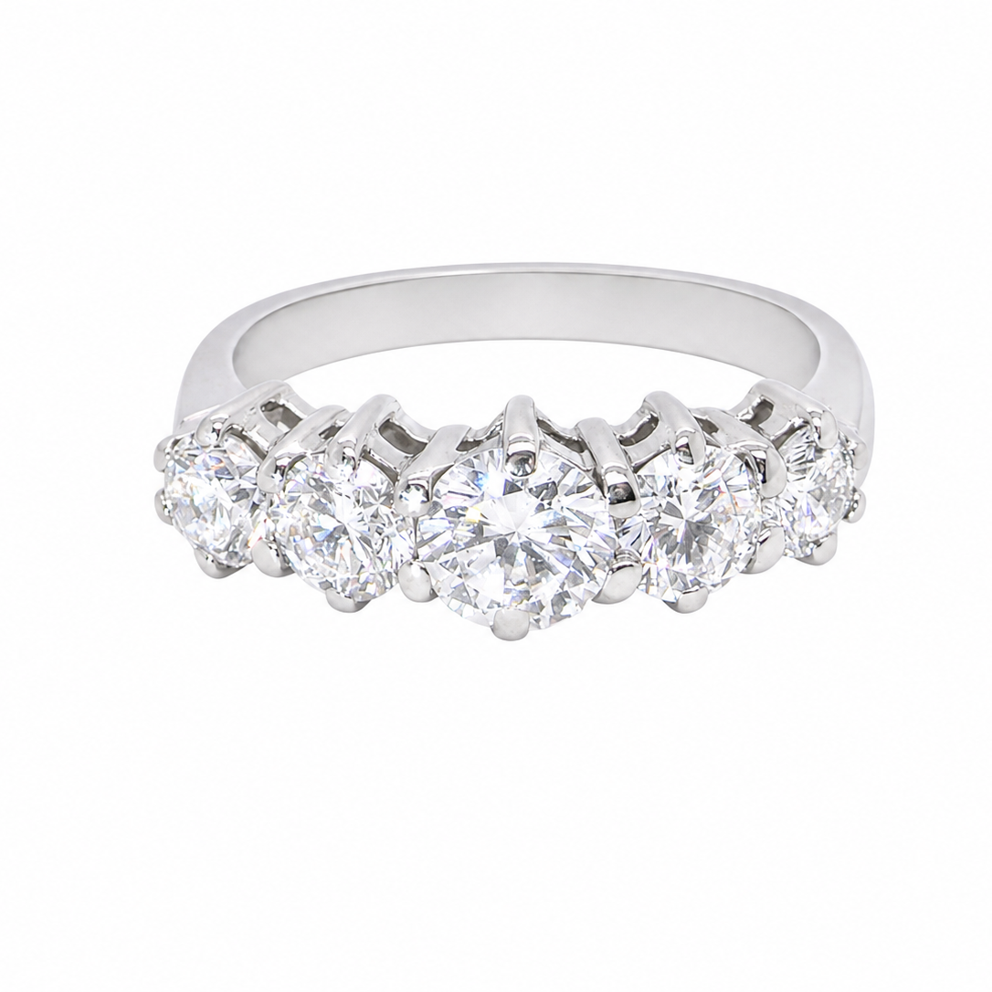 A stunning half hoop ring featuring five exceptional brilliant-cut white diamonds, expertly claw set in 18ct white gold.