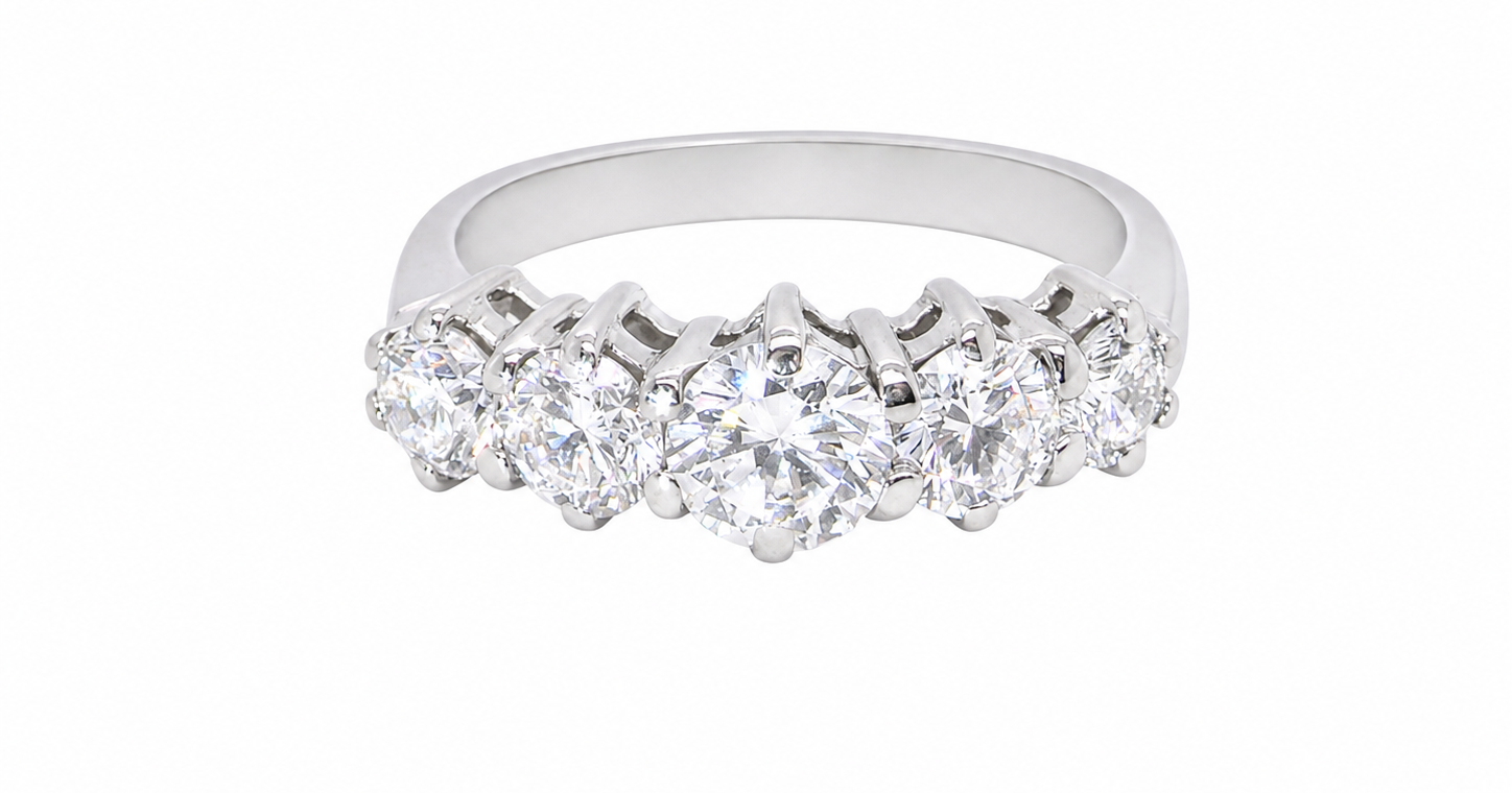 A stunning half hoop ring featuring five exceptional brilliant-cut white diamonds, expertly claw set in 18ct white gold.