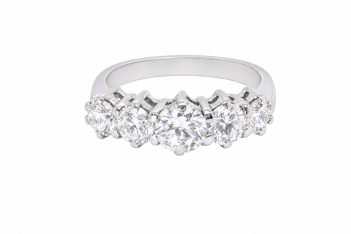 A stunning half hoop ring featuring five exceptional brilliant-cut white diamonds, expertly claw set in 18ct white gold.