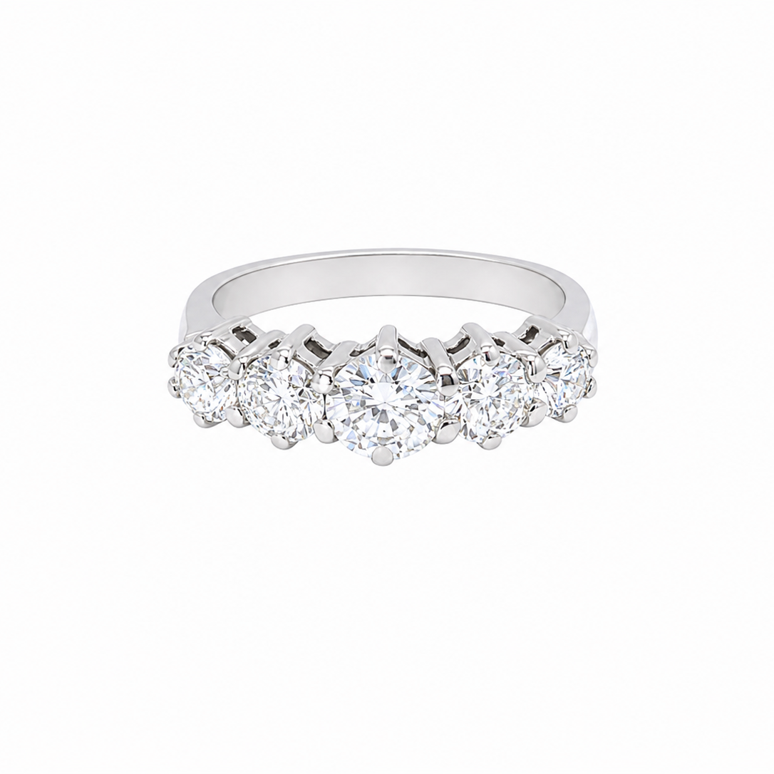 A stunning half hoop ring featuring five exceptional brilliant-cut white diamonds, expertly claw set in 18ct white gold.
The centre diamond measures approximately 5.8mm (estimated 0.70 carats), flanked by a 5.0mm diamond on each side, with 4.5mm diamonds at each end.