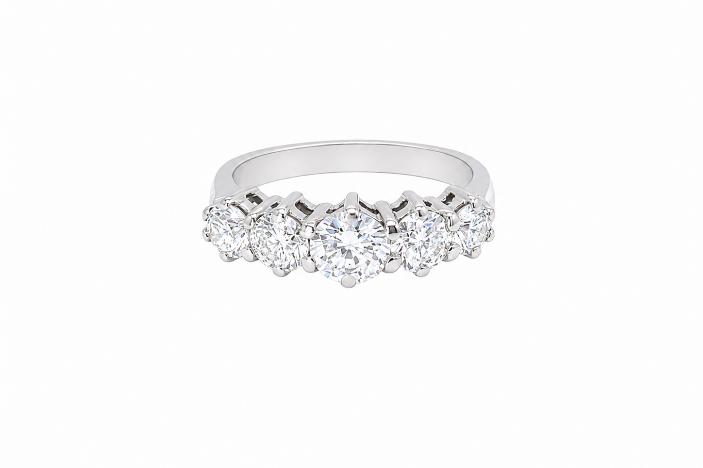 A stunning half hoop ring featuring five exceptional brilliant-cut white diamonds, expertly claw set in 18ct white gold.
The centre diamond measures approximately 5.8mm (estimated 0.70 carats), flanked by a 5.0mm diamond on each side, with 4.5mm diamonds at each end.