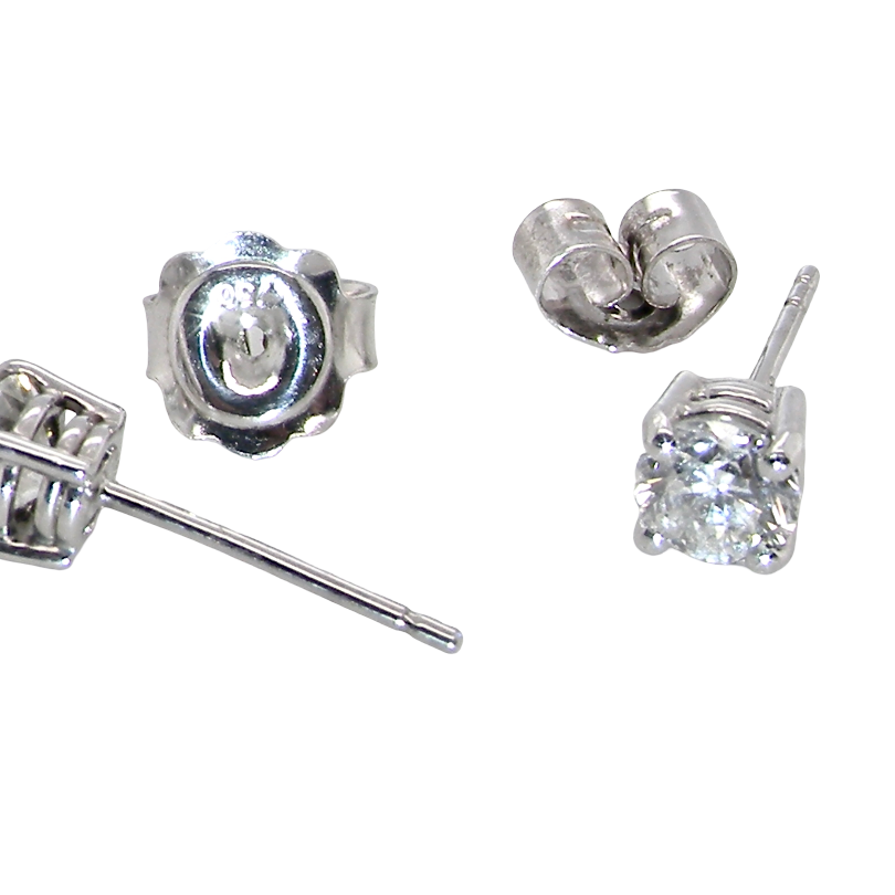 Four silver stud earrings shown on a plain white background, including front-facing and side/back views. The earrings feature clear gemstones in a prong setting with post and butterfly backings visible.