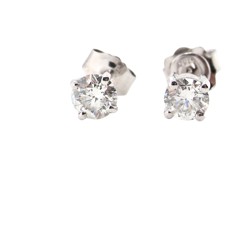 A pair of round-cut diamond stud earrings set in a silver-toned metal, shown from a side angle against a plain white background.