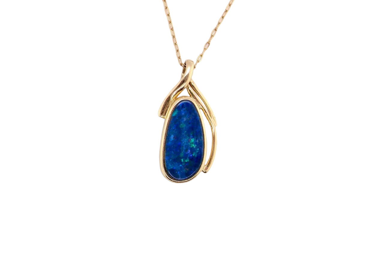 A stunning pendant containing an oval shaped black opal