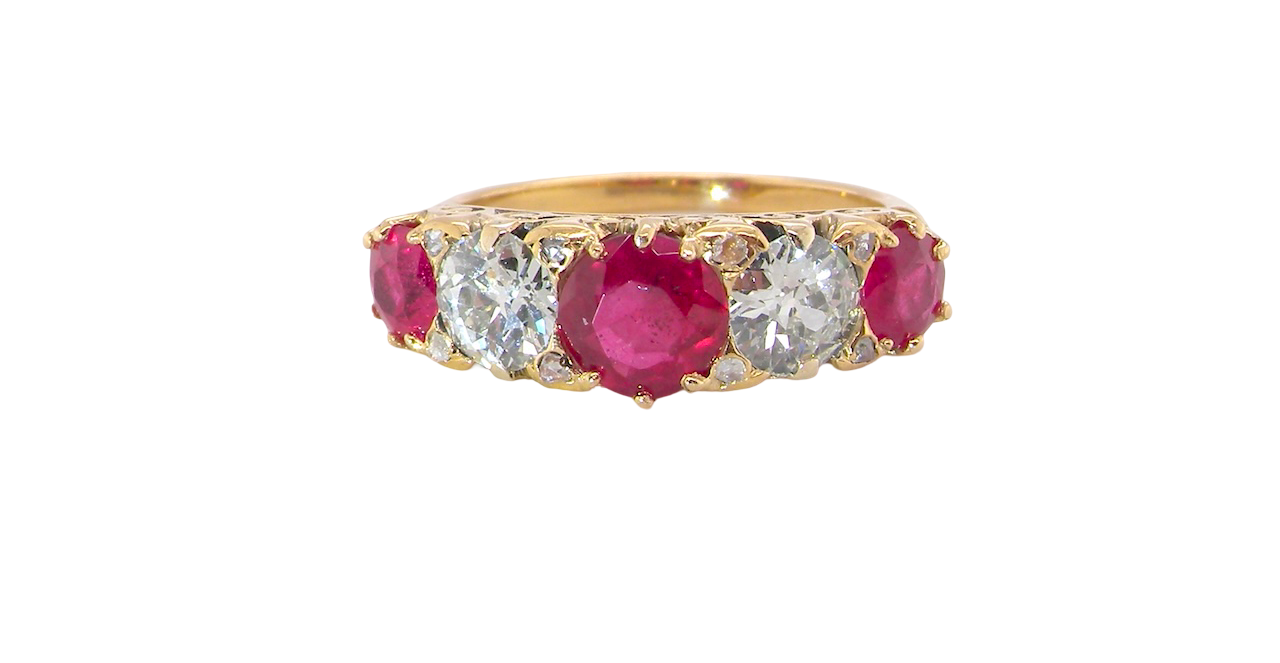A superb Victorian ring, carved boat shaped head. Set with fine rubies ,