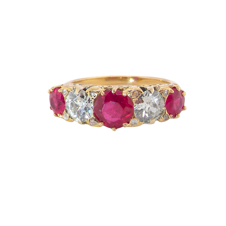 A superb Victorian ring, carved boat shaped head. Set with fine rubies ,