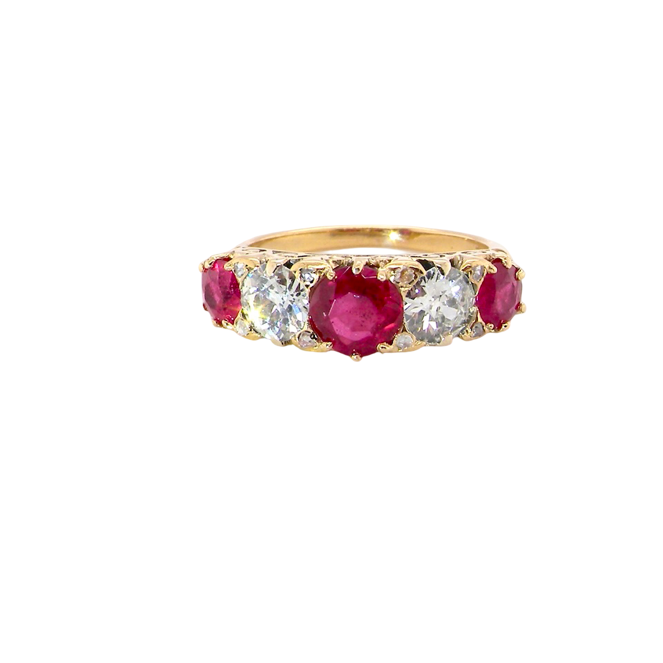 A superb Victorian ring, carved boat shaped head. Set with three fine rubies ,