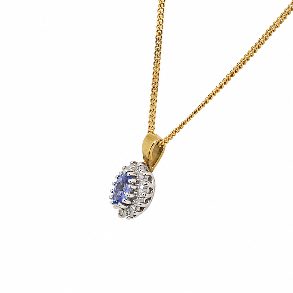 Side view of tanzanite and diamond pendant