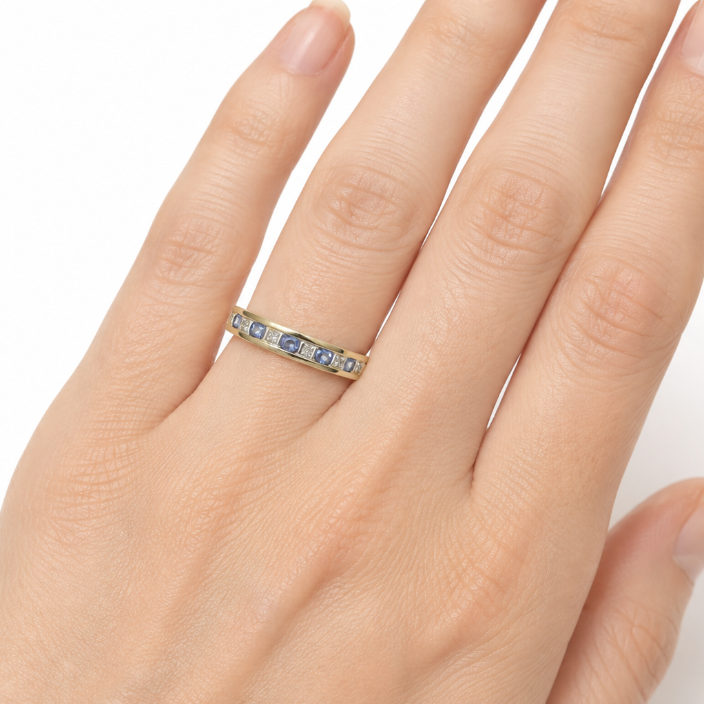 Tanzanite eternity ring on a hand