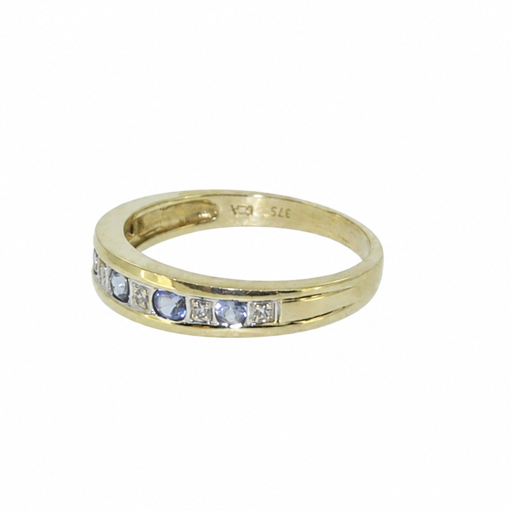 Side view of tanzanite and diamond eternity ring