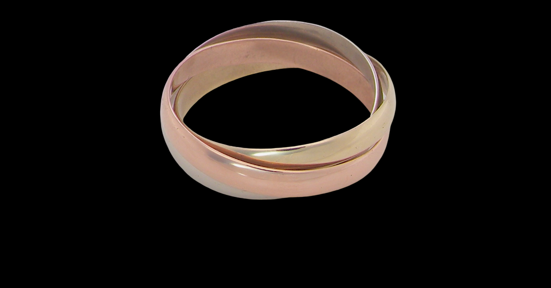 A three colour gold ring (AKA Russian wedding ring) Each band just under 3mm wide,
Yellow, white and rose gold,
