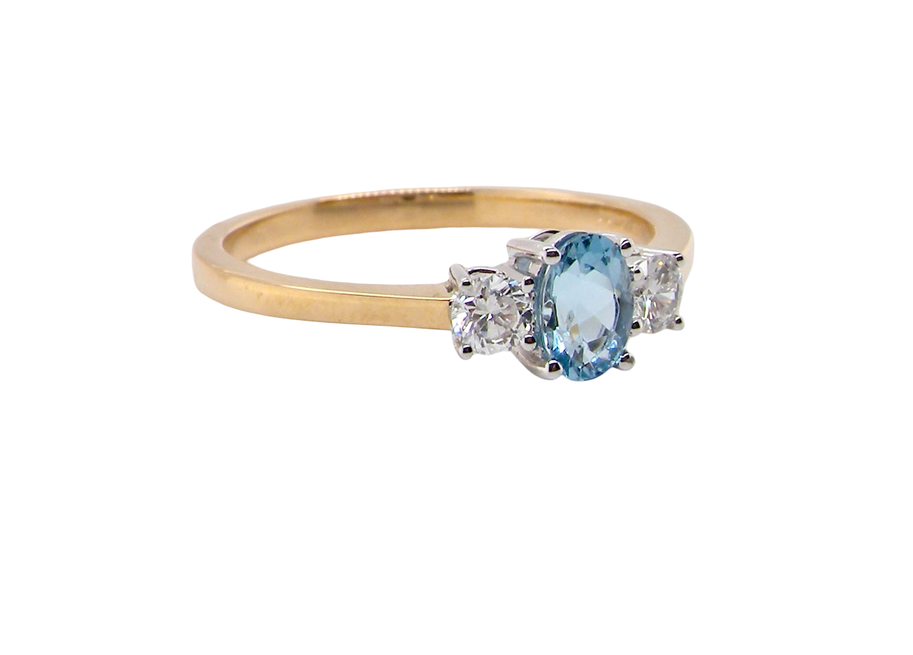 A three stone Aquamarine and Diamond ring