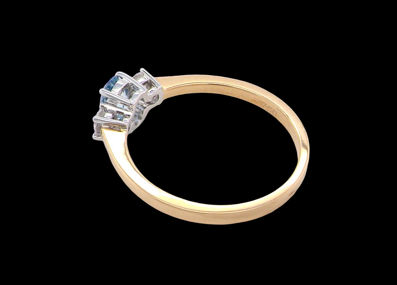 A three stone Aquamarine and Diamond ring