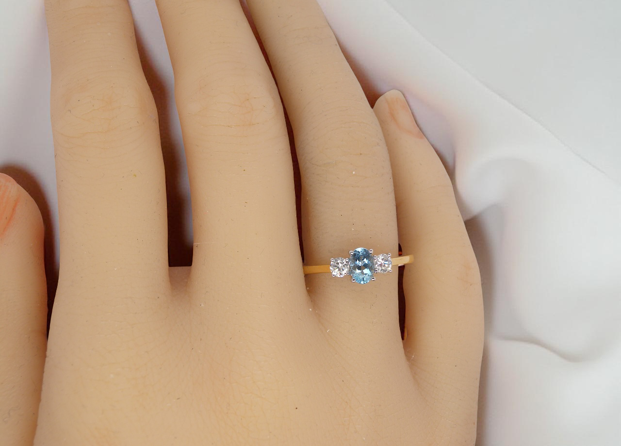 A three stone Aquamarine and Diamond ring